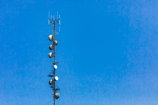 Cellular base station against blue sky. - Photo, Image