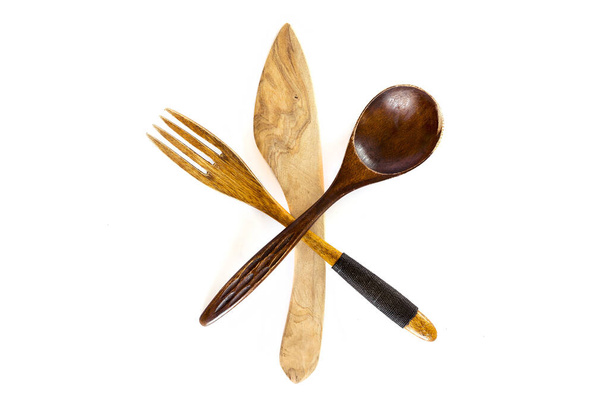 Wooden knife, fork and spoon on white background - Valokuva, kuva