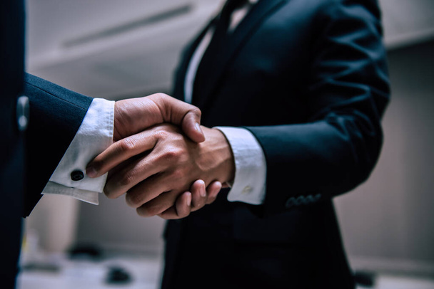 Business people shaking hands, finishing up a meeting,Negotiations were successfully - Fotoğraf, Görsel