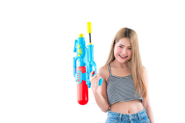 Asian beautiful woman with gun water in hand on white background,Festival songkran day at thailand,The best of festival of thai,Land of  smile - Foto, Bild