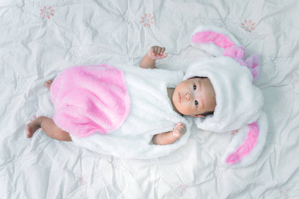 Close up cute asian baby girl in a rabbit dress - Foto, Imagem