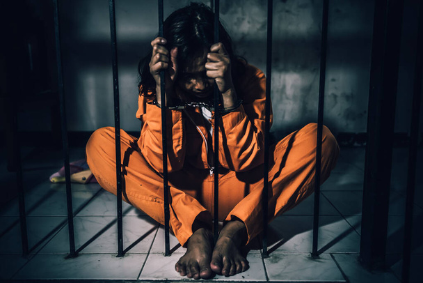 Portrait of women desperate to catch the iron prison, prisoner concept - Foto, imagen