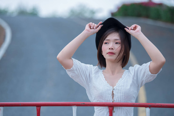 Portrait of beautiful young asian woman wear white dress outdoor,Lifestyle of modern woman - Foto, Bild