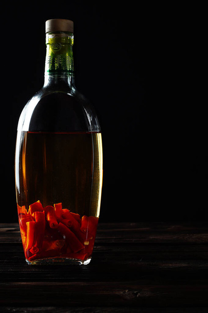 Medicinal tincture of pepper in a bottle. - Zdjęcie, obraz