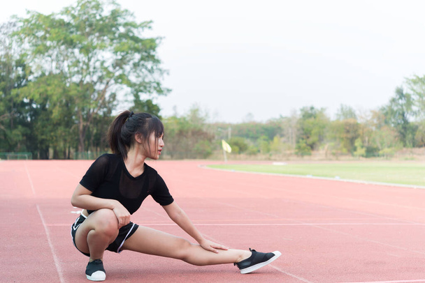 Beautiful asian woman stretching body,Thailand people,A girl love health,Exercise for strong body - Fotografie, Obrázek