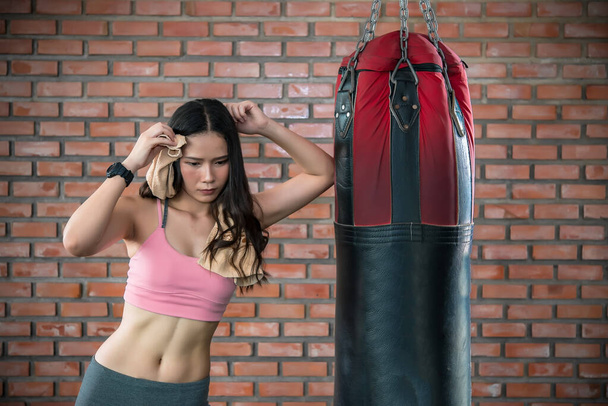Portrait of asian woman training at the gym  - Fotó, kép