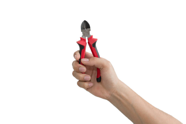 Cutting plier in hand on white background - Foto, immagini
