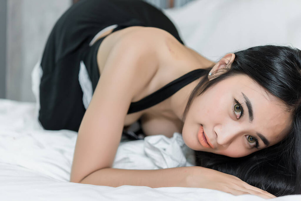 Portrait of Asian sexy woman on the bed - Photo, Image