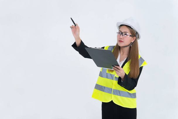 Beautiful asian Engineer woman Wear a suit, glasses and wearing a helmet on white background,Thailand people - Photo, image