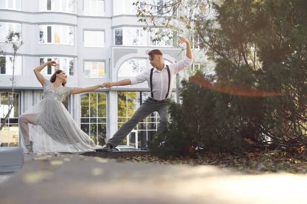 Beautiful young couple practicing dance moves outdoors - Photo, Image