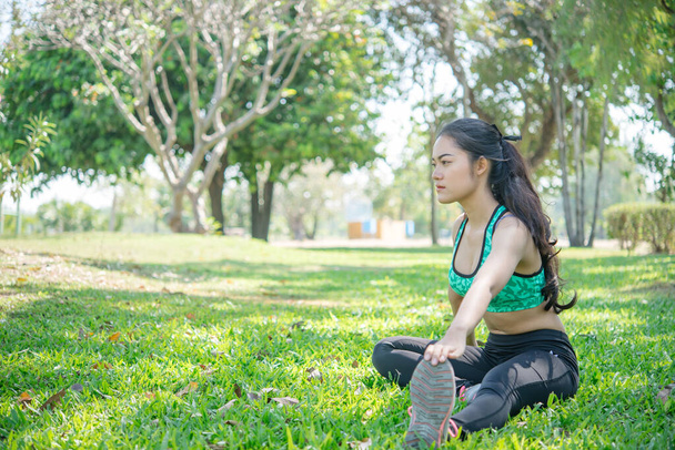 Asian slim woman warm up before work out,slim girl exercise for life,Thailand people,Stretching body before jogging - Fotografie, Obrázek