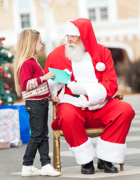 Santa Claus Taking Letter From Girl - Foto, afbeelding
