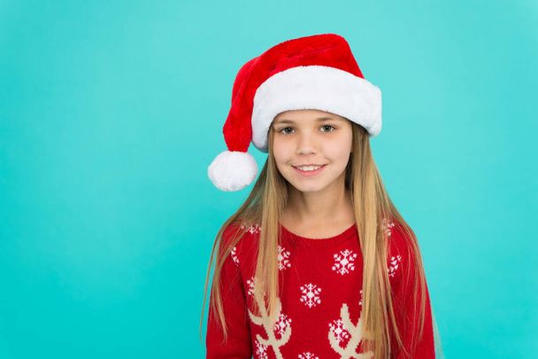 Winter spirit. New year party. Santa claus kid. Little girl child in santa hat. Happy winter holidays. Small girl. Christmas shopping. Adorable smiling baby waiting for Santa. Greetings concept - Foto, imagen