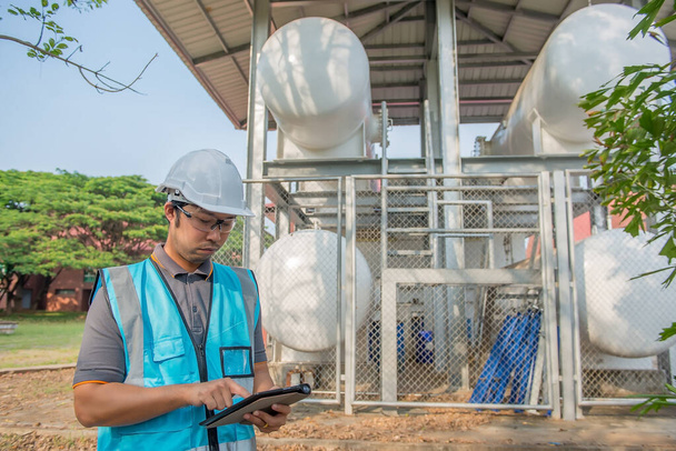 Engineers work place to keep liquid helium,preventive maintenance schedule checking,Thailand people - Foto, imagen
