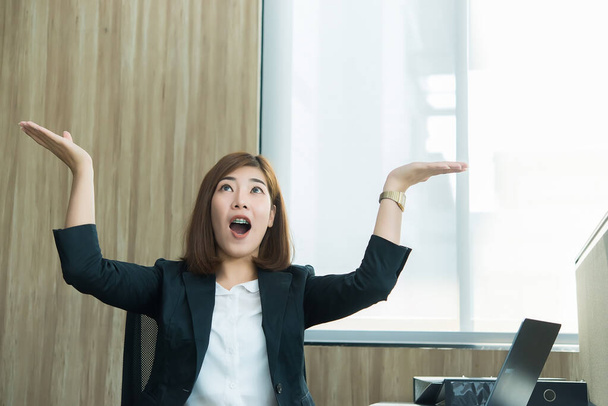 Business woman wow from laptop,Looking stock market,Happy thai woman concept,Secretary working in office - Фото, зображення