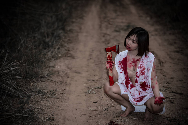 Portrait of asian woman make up ghost face,Horror scene,Scary background,Halloween poster,Thailand people,Lady has a axe in hand,Lovely zombie concept - Foto, immagini