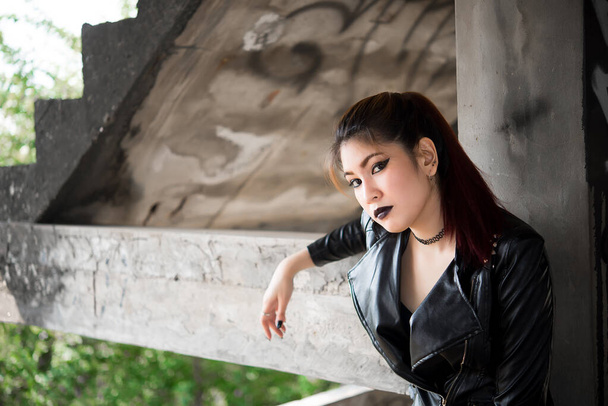 Portrait of asian with black leather dress punk style,Thailand people take a picture - 写真・画像