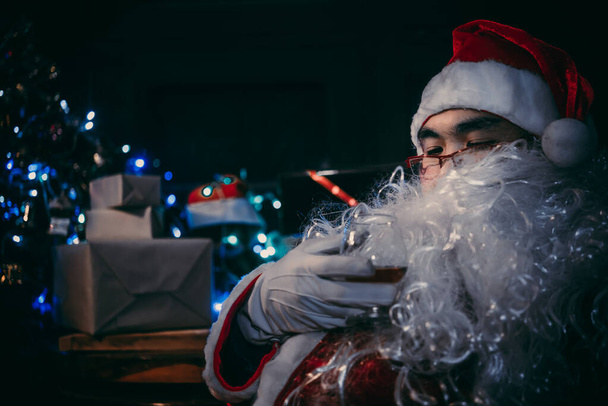 Portrait of Happy Santa clause drink whisky, Merry christmas concept - Фото, изображение