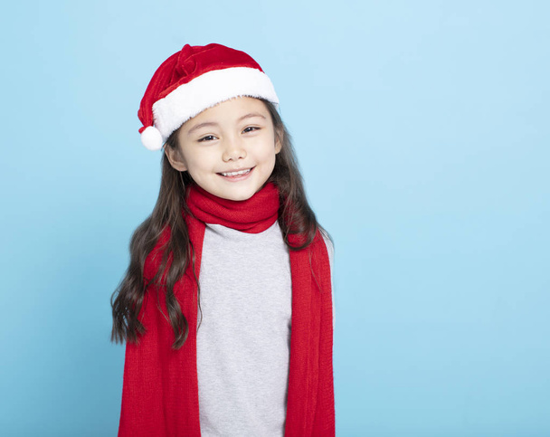 niña feliz en sombrero de Santa
 - Foto, imagen