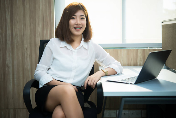 Beautiful asian woman working in a office,Thailand people,Business woman work at company - Foto, afbeelding