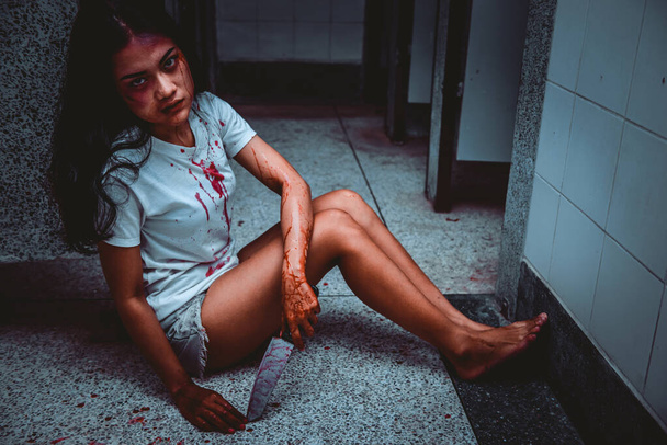 Beautiful asian woman holding knife in hand,Murder crime concept,Blood on the body - Φωτογραφία, εικόνα
