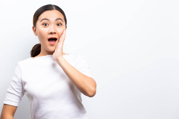 Happy woman has surprised and shouting to copy space isolated ov - 写真・画像