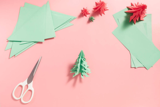 Making origami Christmas trees - Photo, image