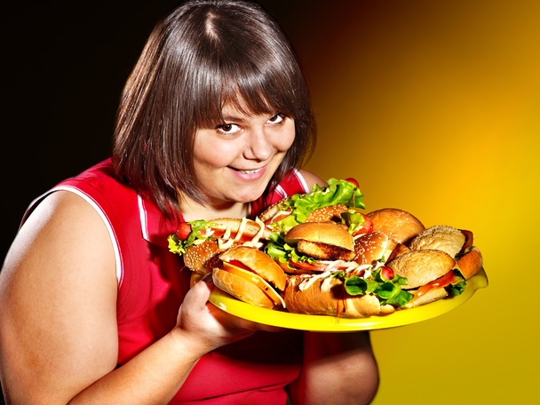Женщина с гамбургером
. - Фото, изображение