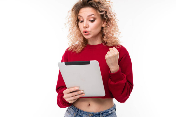young woman posing with digital tablet against white background   - Foto, Imagen