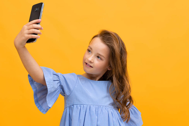 cute little girl with smartphone  - Photo, Image