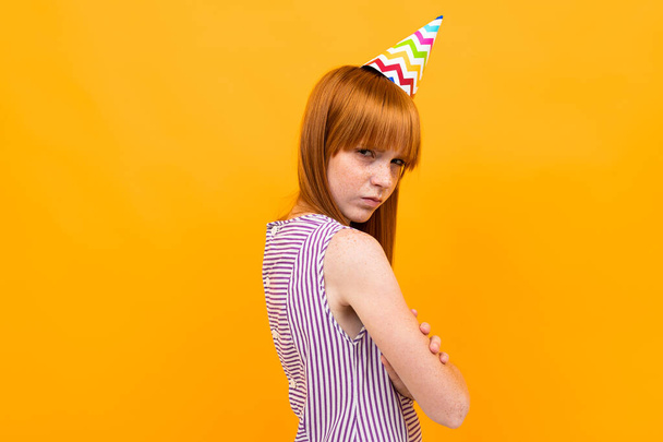 birthday girl posing against orange  - Φωτογραφία, εικόνα