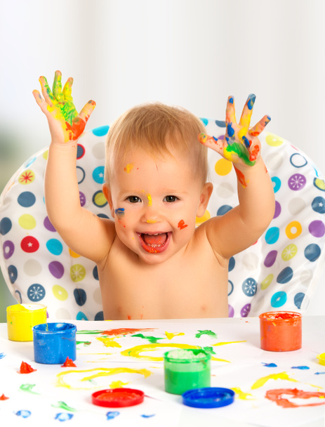 happy child draws with colored paints hands - Photo, Image