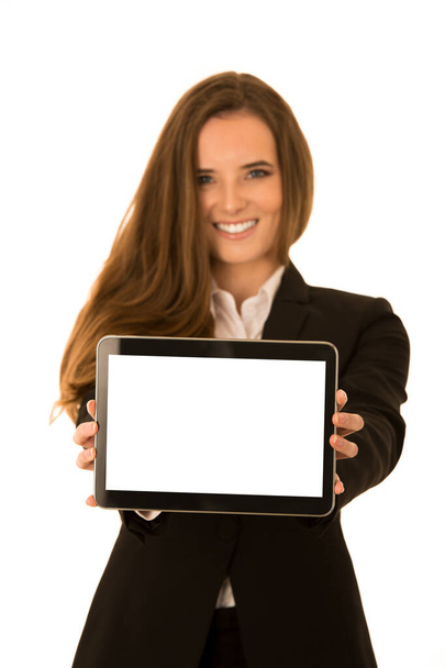 Beautiful young woman shows tablet with blank display - copy spa - Φωτογραφία, εικόνα