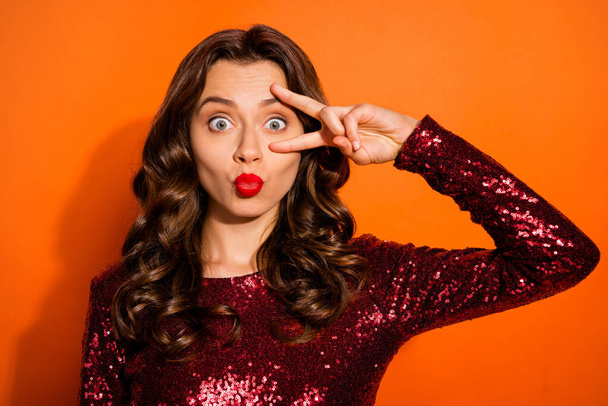 Portrait of funky sweet girl having weekends visit 14-february make v-signs send air kisses to people wear classy chic outfit isolated over orange color background - Foto, afbeelding