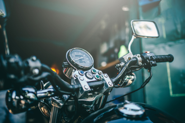 Close up view view over the handlebars of motorcycle, speedometer.  - 写真・画像