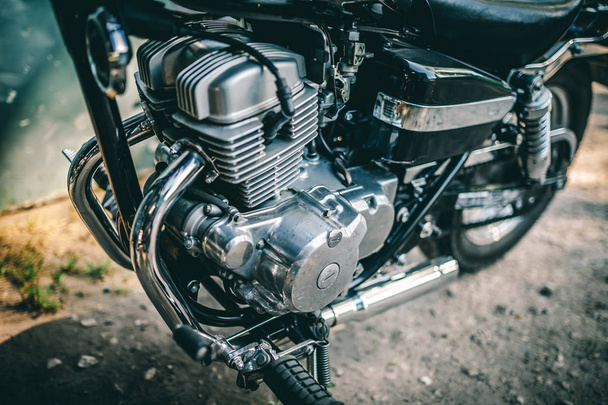 Closeup of motorcycle engine on background - Foto, afbeelding