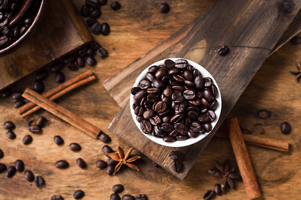 coffee beans on table. Wooden desk. dark background - Image - Photo, image