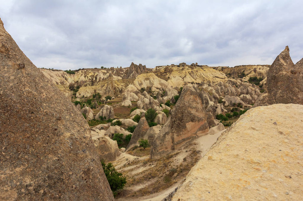 Stone formations in valley and mountains Cappadocia, Turkey - Photo, Image