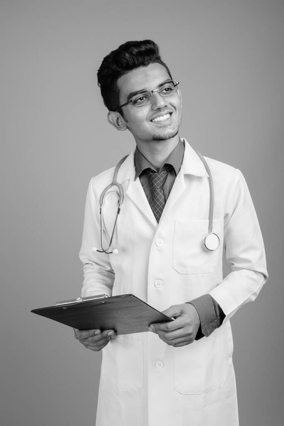 Portrait of young Indian man doctor with eyeglasses - Foto, Imagen