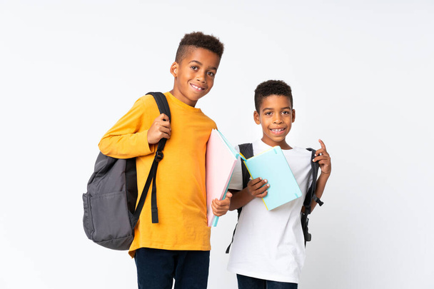 Two boys African American students over isolated white background - Fotografie, Obrázek