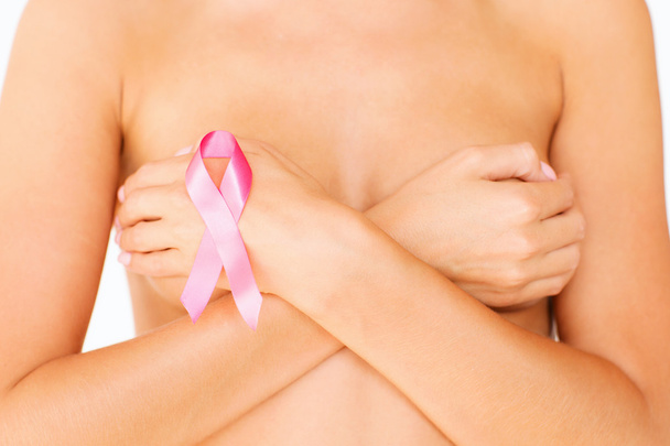 Naked woman with breast cancer awareness ribbon - Foto, imagen