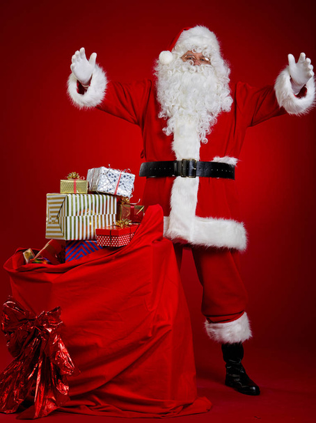 Santa Claus with a bag full of presents - 写真・画像