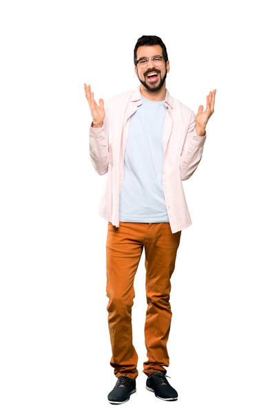 Full-length shot of Handsome man with beard smiling a lot over isolated white background - Foto, Bild