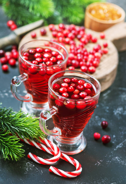 cranberry drink and berries, christmas drink in glass and on a table - Foto, Imagen