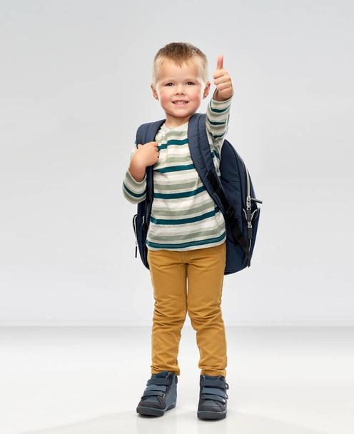 portrait of smiling boy with school backpack - 写真・画像