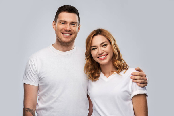 portrait of happy couple in white t-shirts - Fotó, kép