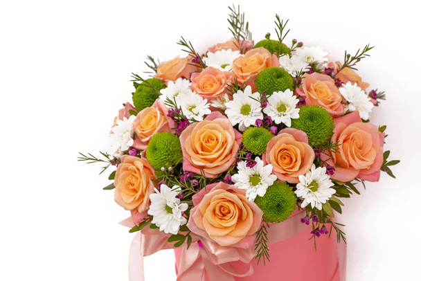Beautiful bouquet in a coral luxury present box with a pink bow, isolated on white background - Valokuva, kuva
