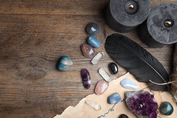 Flat lay composition with different gemstones on wooden background. Space for text - Foto, Imagem