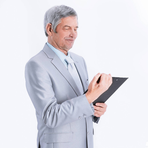 Mature businessman with documents.isolated on a white - Photo, image