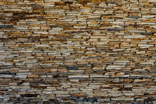 Taş levha duvarı. Dekoratif taş duvar sörfü deseni - Fotoğraf, Görsel